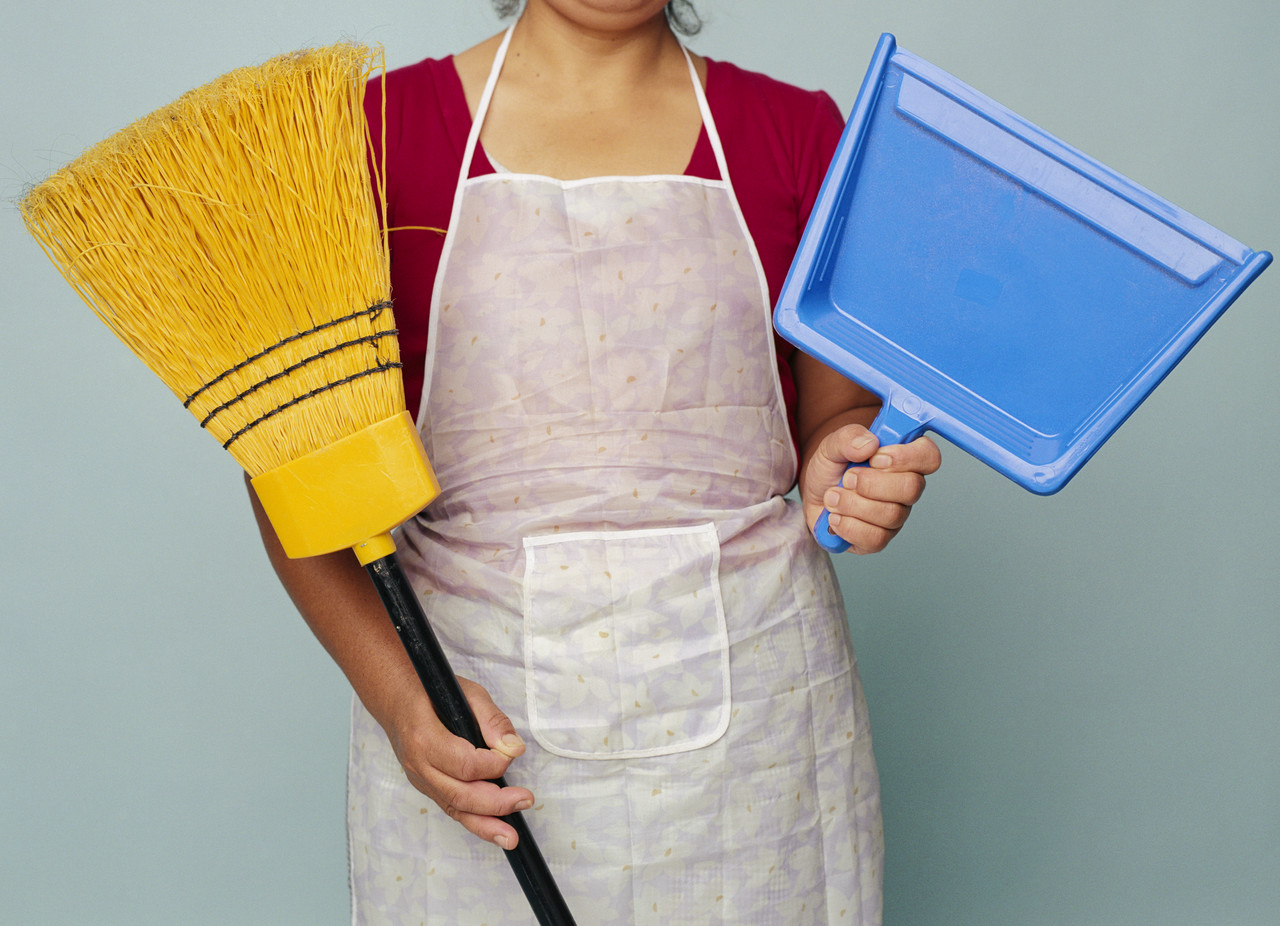 Woman Holding Broom and Dustpan