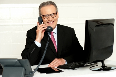 stockimages man at desk on phone